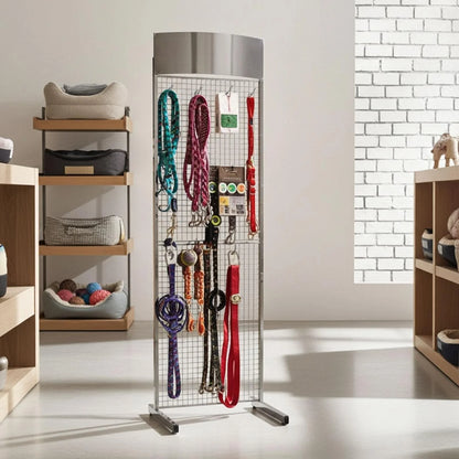 A tall metal mesh display stand with dog lead products hanging on hooks. The stand is in metal silver with a curved header.