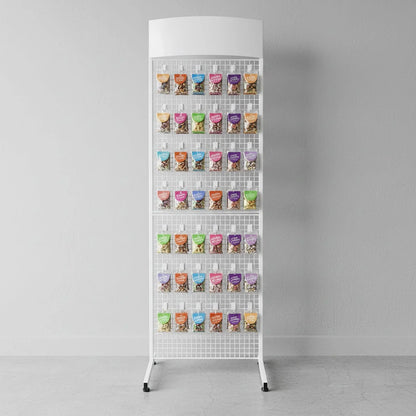 A white metal mesh display stand with multiple small  pouches hanging on its hooks, photographed against a plain light grey wall and floor.